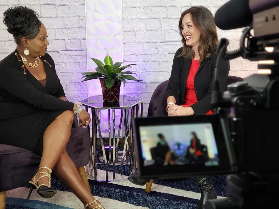 Business owner sharing her story during a television interview