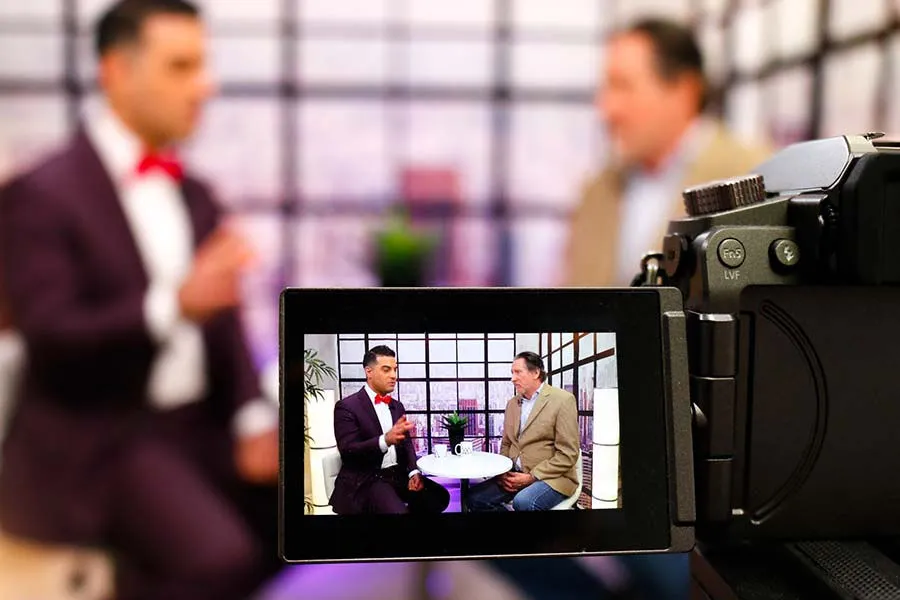 Television production camera capturing an interview